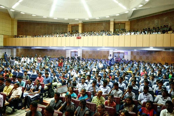 Group Of Students And Their Parents Gathering In A Hall For Career Guidence program.